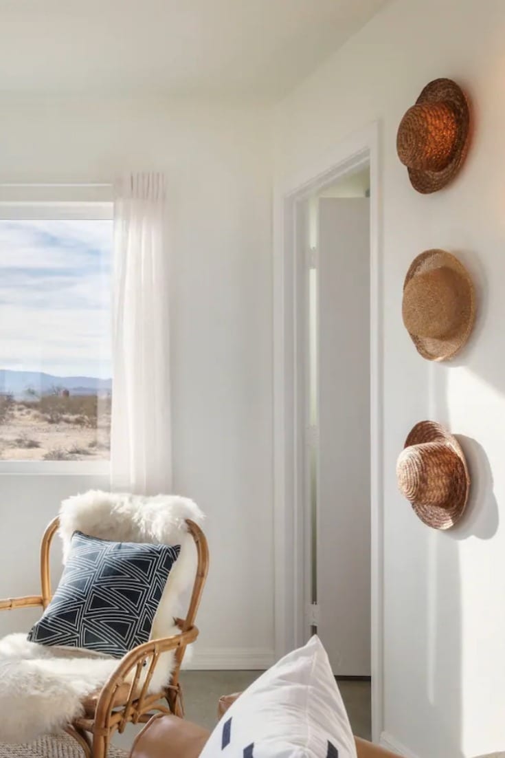 Living room with hats on wall